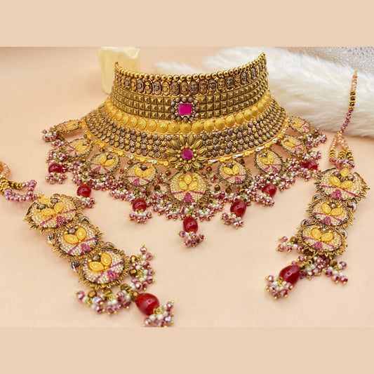 Regal Maroon Bridal Set Adorned with Fine Gold Detailing